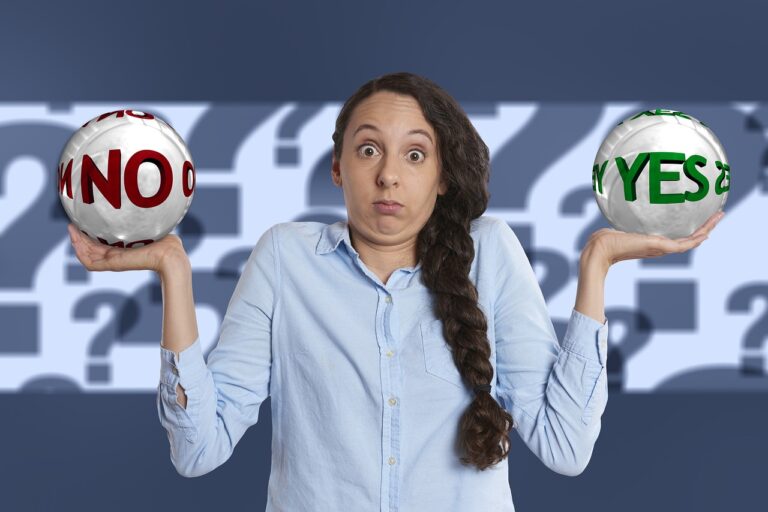 Woman holding 2 objects with yes and no written on them. Confused face